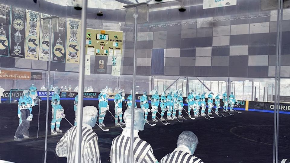 The Melbourne Mustangs starting lineup for their Good Friday Appeal game. A colour inversion filter has been applied.