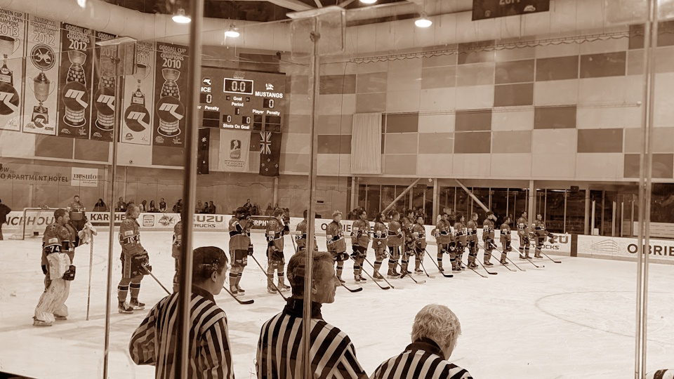 The Melbourne Mustangs starting lineup for their Good Friday Appeal game. A sepia filter has been applied.